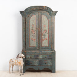 Rococo cabinet from Jämtland, northern Sweden. Dry scraped to the original paint with marbled drawers and doors with flowers.