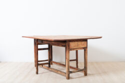 Folk art drop leaf table with drawer. Unusual model a long mid section and short drop leafs
