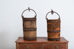 Pair of wooden buckets with sturdy hardware and handle in iron. Manufactured in northern Sweden around the mid 1800s. Natural patina after years of use. 