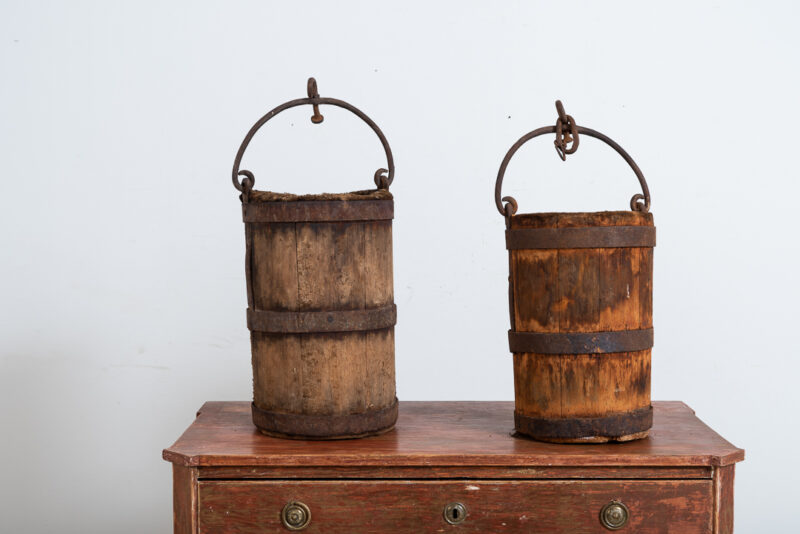 Pair of wooden buckets with sturdy hardware and handle in iron. Manufactured in northern Sweden around the mid 1800s. Natural patina after years of use.