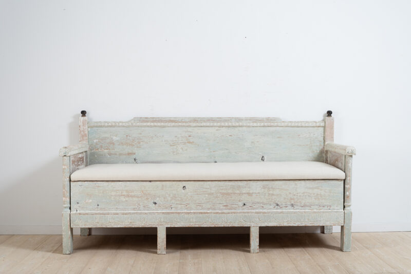 Gustavian provincial sofa from northern Sweden. Hand scraped to the original light blue / green paint. Decorated with carved wooden decor