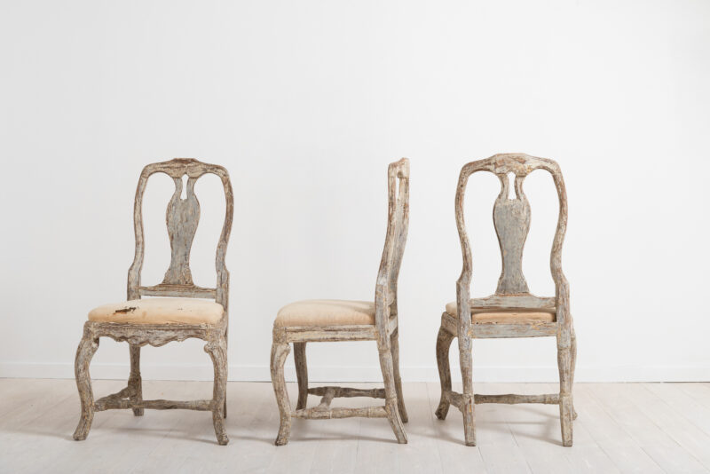 Three late baroque chairs from the middle of Sweden. Manufactured around 1770 the chairs are dry scarped to the original paint. Original seats