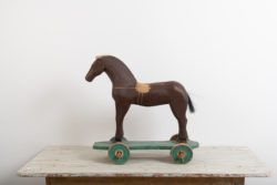 Antique toy horse in painted pine. The paint is original as is the condition. Manufactured in Sweden around 1880. One wheel is newer, most likely from the early 1900s. 