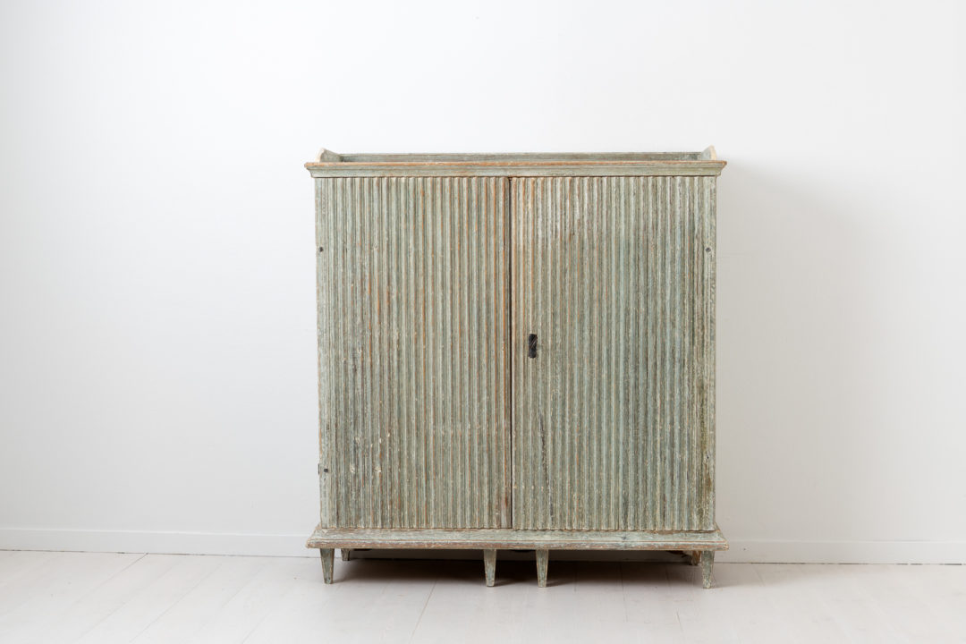 Pale green gustavian sideboard from Northern Sweden. The sideboard is from the late 1700s and made in Swedish pine. Dry scraped by hand to the original pale green paint