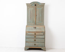 Blue rococo cabinet with desk top from Sweden. The cabinet is from the mid 1700s and made from oak and dry scraped by hand to the original blue paint
