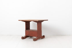 Country folk art table from the late 18th century. The table is pine with the original red paint as well as the authentic patina from the 18th century