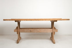 Country dining trestle table from Northern Sweden. The table is from the mid 19th century and made in pine with a solid table top .