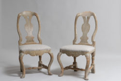 Pair of Swedish rococo chairs from the late 18th century, 1780 to 1790. The chairs are northern Swedish and dry scraped to the original paint
