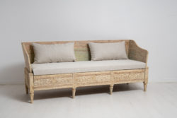 Rare Swedish gustavian sofa from the late 1700s. The sofa is a so called trågsoffa and is solid pine with scraped to original paint.