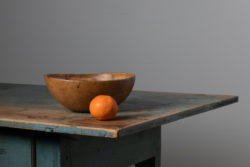 Round antique wood bowl from Northern Sweden made around the late 1800s. The bowl has higher edges and is a simple but effective way to bring antique character and easy elegance to any room. The patina is completely authentic and the wood shines with the warm patina of time. Bowls like this was used daily for storage and preparation of food so they are rare to find today. Especially in as good condition as this one.