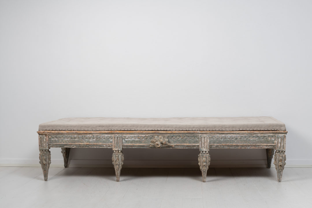 Rare gustavian bench from Sweden. The bench is from the late 18th century, circa 1770, and has unusually rich hand-carved decorations