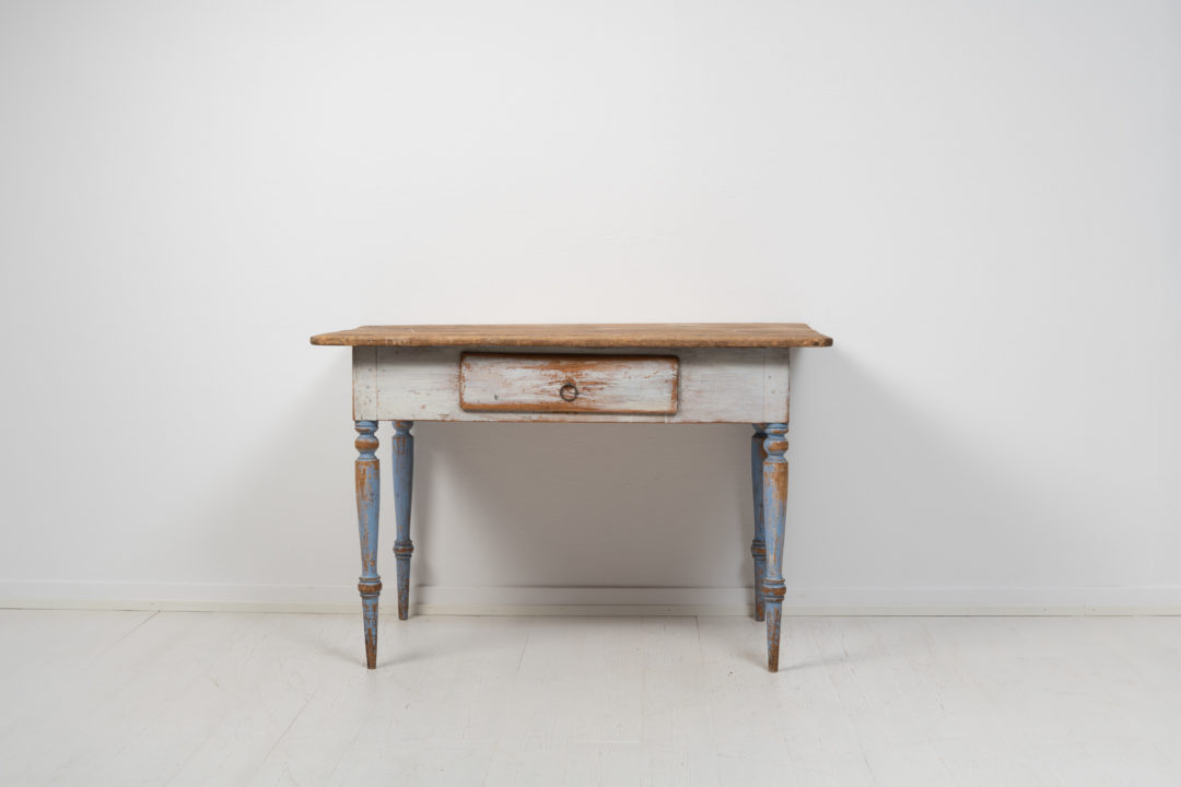 Small folk art table from northern Sweden made around 1850. The table is painted pine with the original first layer of paint that has the authentic patina of time