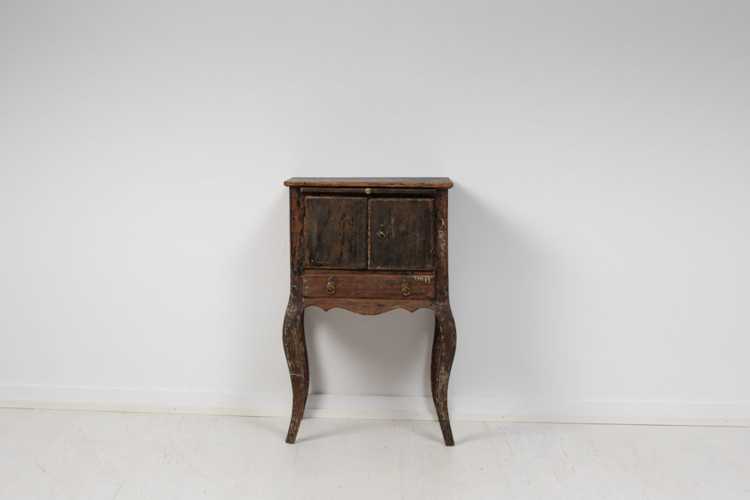 Black Swedish rococo nightstand from the 18th century, around 1770 to 1780. The nightstand is an unusual model and has clear rococo features