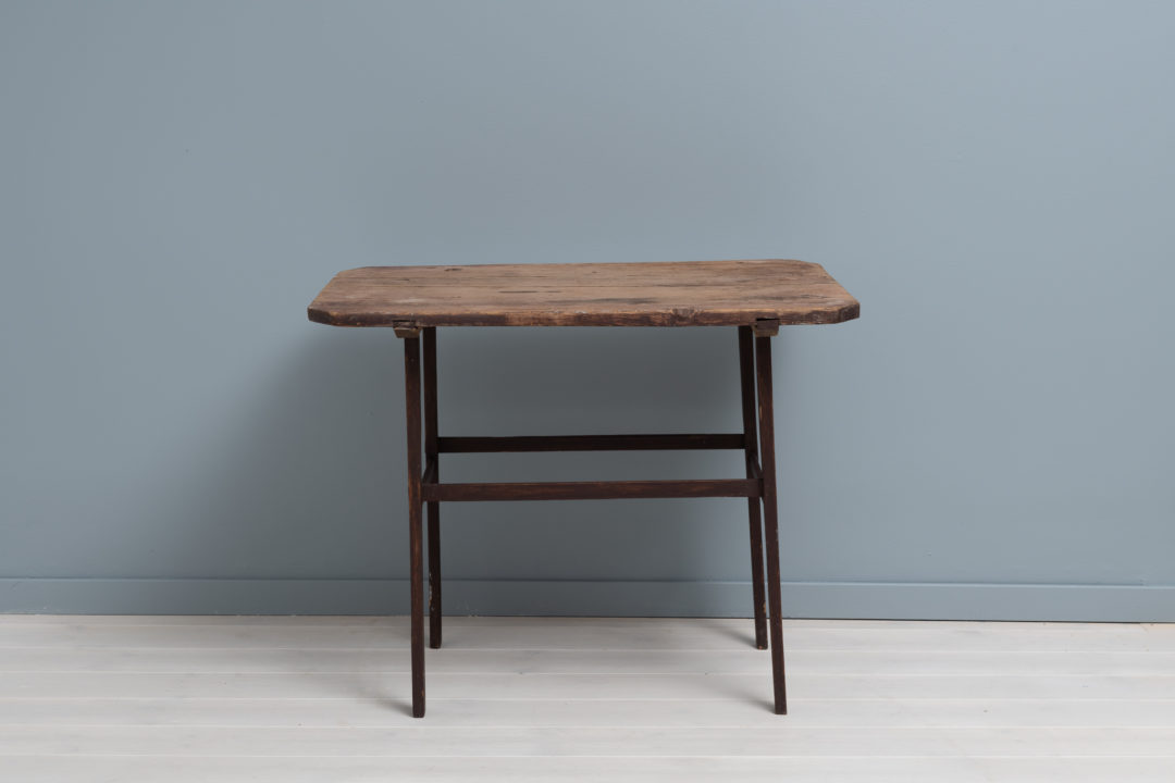 Rare folk art table from Sweden, dated underneath to 1819. The table is pine and has the warm patina of aged wood. Marked with the owners house mark