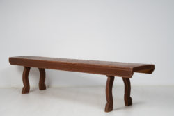 Swedish country house bench made in solid pine during the mid 19th century, around 1850. The legs are curved with a simple hand-carved detail above the foot