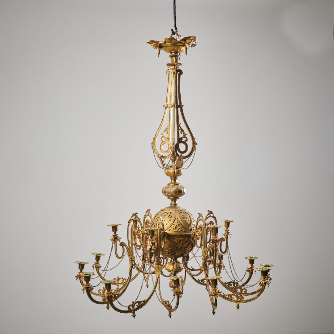 Antique Swedish bronzed chandelier made during the mid 1800s, around 1850 to 1860. The chandelier is made in bronzed metal with a richly decorated round frame