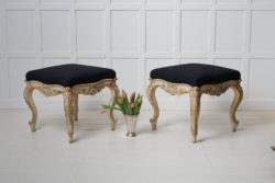 Pair of large upholstered stools in rococo style made during the rococo revival in the late 19th century. The stools are unusually large