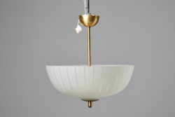 Vintage Swedish ceiling light from around the 1940 with a cover in glass and suspension in brass. The light has three light sources and the glass cover