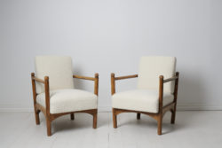 Swedish grace upholstered armchairs from the early 20th century, around 1920 to 1930. The armchairs are unusual, in style of Axel Einar Hjort