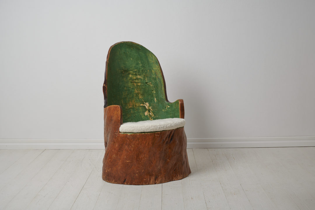 Antique Swedish "Kubbstol" or "Stockstol" as they are also known. The chair is a primitive furniture made by hand from one large, solid log of wood