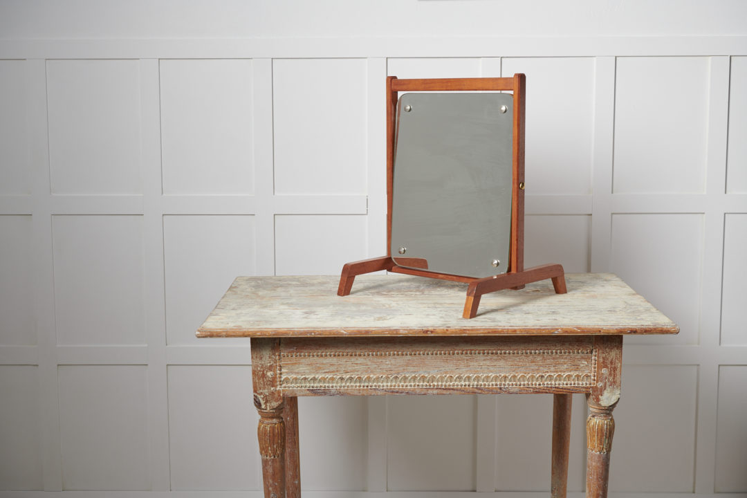 Vintage teak table mirror from Sweden. The mirror is made around the 1960s and is a timeless interior design item with plenty of retro charm