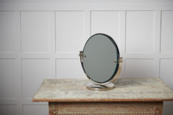 Art deco table mirror from Sweden made around the 1930s. The mirror has a chromed frame and an adjustable mirror.