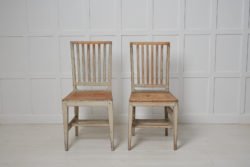 Antique Swedish country chairs from the early 1800s, around 1820 to 1830. The chairs are genuine country house furniture made in gustavian style.