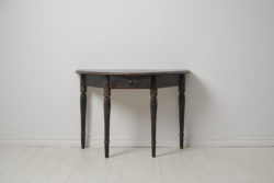 Antique Swedish console table or wall table. The table has a demi lune shape with four legs and a centered drawer in the apron.