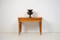 Antique country console table in Gustavian style. All four sides are the same, making it suitable as a freestanding table as well