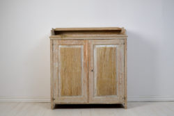 Large genuine Gustavian sideboard from Northern Sweden, made around 1810. The sideboard is crafted from solid pine and scraped by hand down to the original paint