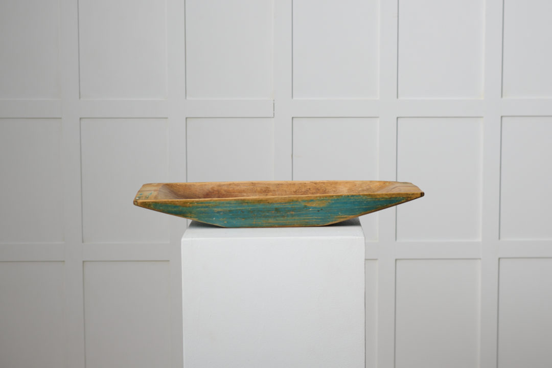 Antique Swedish wooden plate or trough made in northern Sweden around 1820 to 1840. The trough has original blue paint