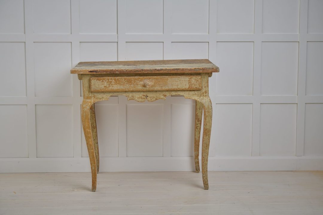 Genuine antique rococo table from Sweden. A country house furniture from the late 1700s made by hand in solid pine
