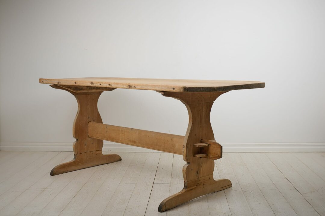 Antique dining trestle table fit for 4-6 people. This folk art, trestle table is from northern Sweden and made around 1830. Made by hand in solid pine and never painted.
