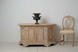 Antique Swedish sideboard from Norrbotten in northern Sweden made around 1820. The sideboard is low and wide and has an unusual shape with slanted corners,