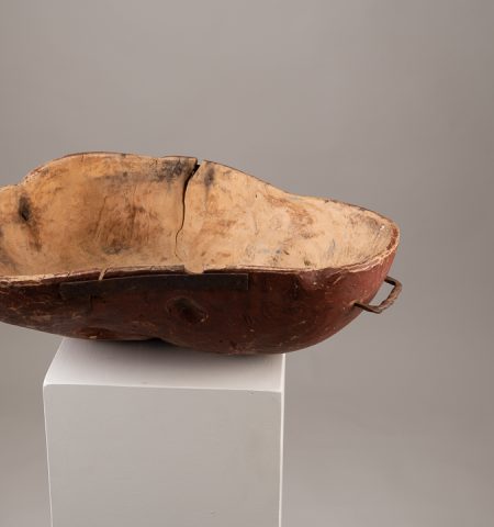 Unusually large wooden bowl with organic shape. The bowl is folk art and made from birch root. The red paint underneath is original to the bowl.