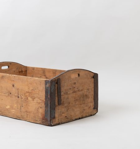 Wooden box in never painted pine. Used for storage in households with enforcements in iron. Made during the late 1800s. Branded with a monogram on one side.