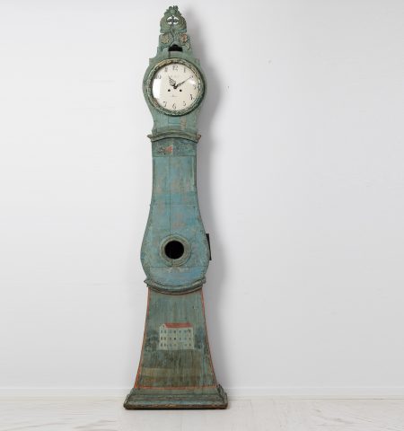 Antique long case clock from northern Sweden made during the late 1700s. The clock has the original blue-green paint with unusual decor