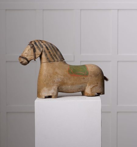 Antique wooden horse sculpture from northern Sweden. The horse is from around 1850 and has a body in pine with original paint