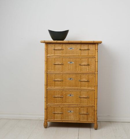 Antique Swedish chest of drawers in colonial style. The chest is tall and narrow with five drawers. The frame is made from solid Swedish pine