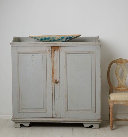 Antique Swedish rustic sideboard from northern Sweden. The sideboard is an authentic country house furniture from around 1840.