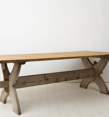 Large antique dining table or trestle table from northern Sweden made during the early 1800s. The table has a thick, solid table top