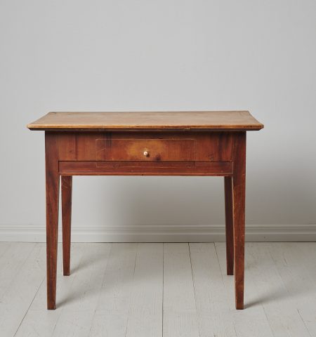 Folk art country table from northern Sweden made around 1820 to 1840 in pine. The table is an authentic Swedish country antique