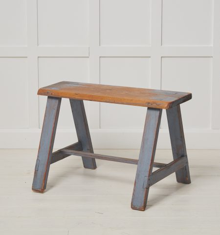 Small antique Swedish bench in folk art. The frame is made by hand in solid Swedish pine. The original light blue paint has genuine distress and patina after use