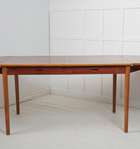 Scandinavian modern desk or dining table by Nils Jonsson for Troeds. Made in Sweden around 1960 with a table top in teak and beech leg frame