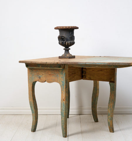 Antique Rococo drop-leaf table from Sweden, crafted around 1770. The surface is uniquely rustic with an attractive distress after 250 years