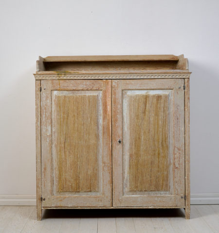 Large genuine Gustavian sideboard from Northern Sweden, made around 1810. The sideboard is crafted from solid pine and scraped by hand down to the original paint