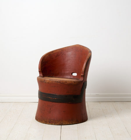 Antique Swedish stump chair with original red paint. The chair is a primitive furniture made by hand from one large, solid log of wood
