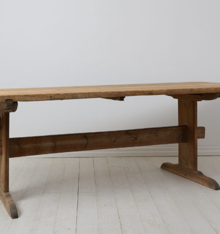 Large trestle dining table from northern Sweden. The table is a genuine antique made by hand in pine around 1820 to 1840