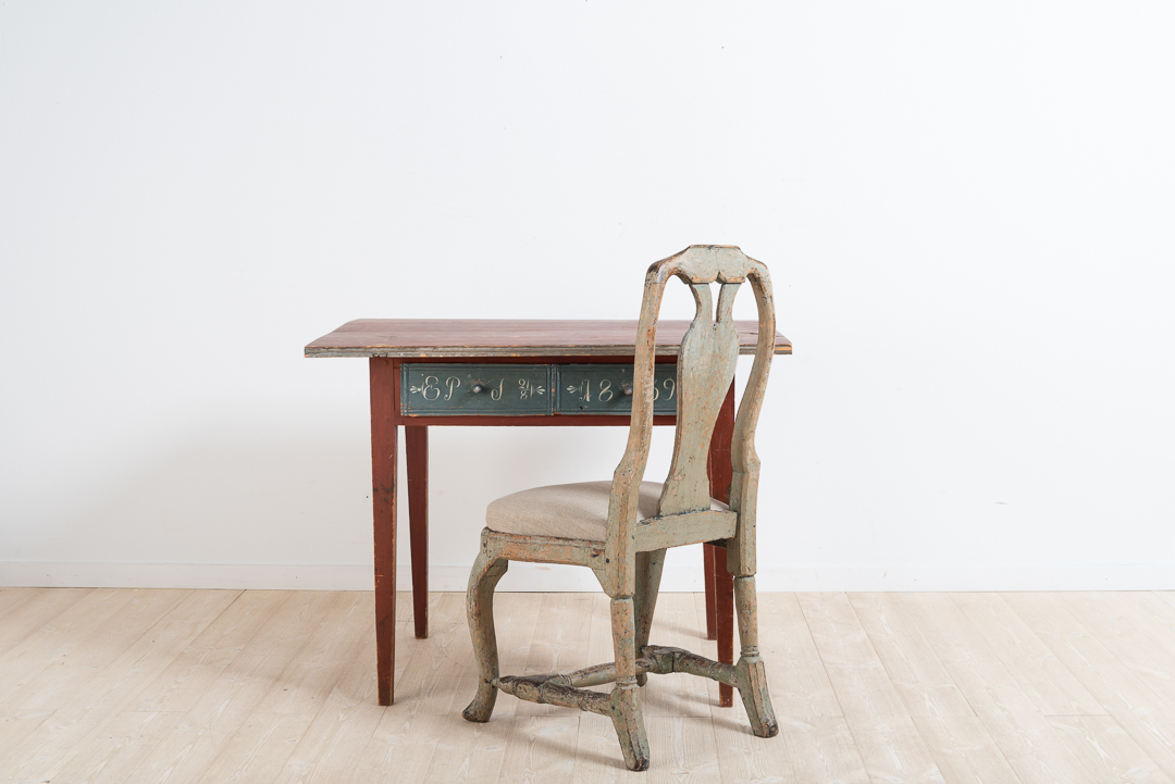 Writers desk with two drawers from the village Alfta in Hälsingland, northern Sweden. Painted pine in untouched original condition with the original paint. Painted monogram and dated 1839.