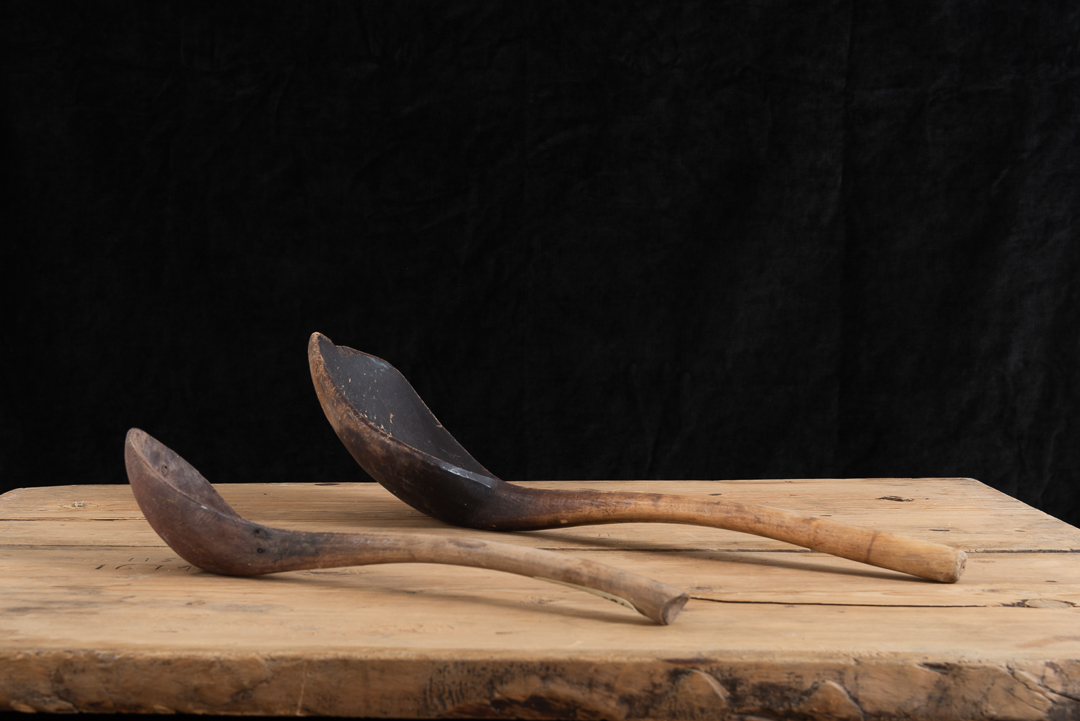 Large wooden ladles or spoons manufactured from Swedish wood. The two ladles were for cooking. The larger has the dating 1852 as well as a monogram.
